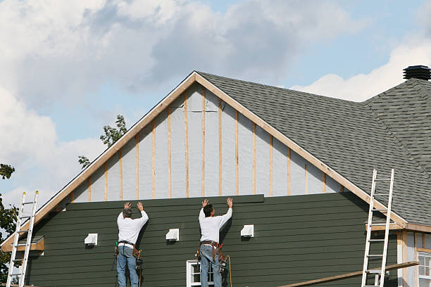 Professional Siding Contractor technician working in Norwood, NY